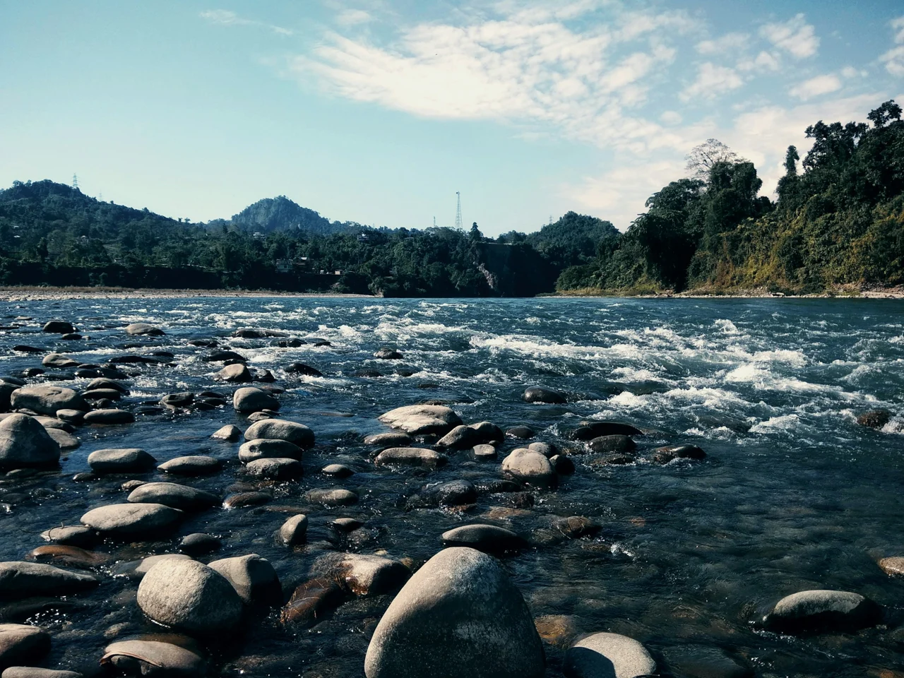 Rocky Kameng River and forested hills at Bhalukpong